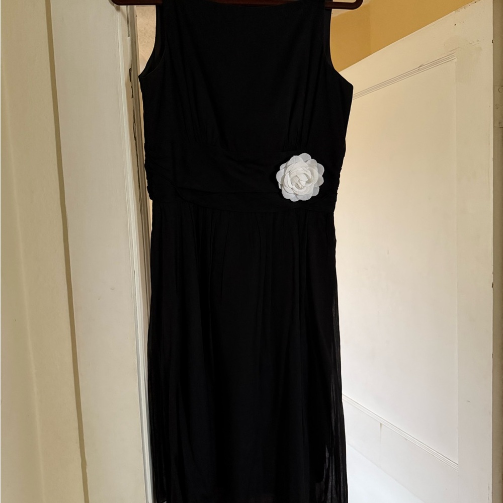 Elegant Black Dress with White Floral Accent